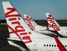 طائرات تشغلها "فيرغن أستراليا القابضة" تقف بمطار مدينة سيدني في أستراليا - المصدر: بلومبرغ