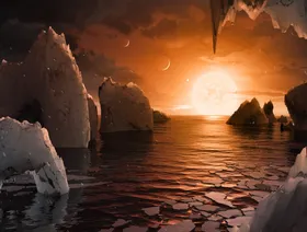 صورة تخيلية من علماء ناسا تظهر ما قد يبدو عليه سطح الكوكب الخارجي "ترابيست-1 إف" ضمن نظام النجم "ترابيست-1" في كوكبة الدلو - Getty Images