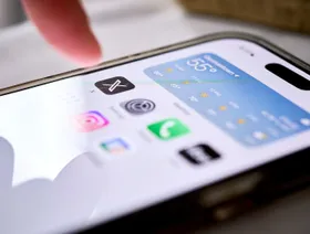 تطبيق "إكس" يظهر على شاشة هاتف ذكي في جيرمانتاون، نيويورك، الولايات المتحدة - بلومبرغ