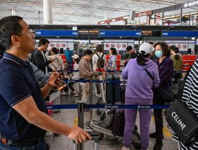 مسافرون في مطار بكين الدولي - بلومبرغ