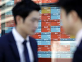 تباين أداء الأسهم الآسيوية مع ترقب قرار الفيدرالي وتخفيف القيود بالصين