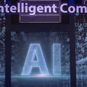 شاشة رقمية تعرض شعار الذكاء الاصطناعي - بلومبرغ