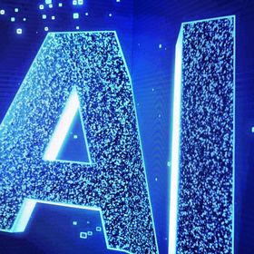 شاشة إلكترونية تعرض الحرفين الأولين من اسم "Artificial Inelegance" (الذكاء الاصطناعي) - المصدر: بلومبرغ