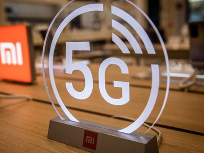 شعار شركة \"شاومي\" وعليه رمز \"5G\" - المصدر: بلومبرغ