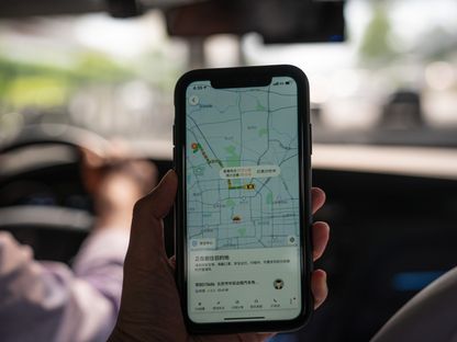 تطبيق \"ديدي\" (Didi) للنقل على هاتف ذكي - المصدر: بلومبرغ