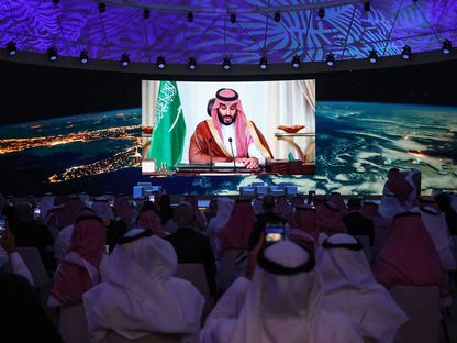 محمد بن سلمان يلقي كلمة عبر الفيديو خلال حفل افتتاح ملتقى المبادرة السعودية الخضراء بالرياض عام 2021 - الشرق/بلومبرغ