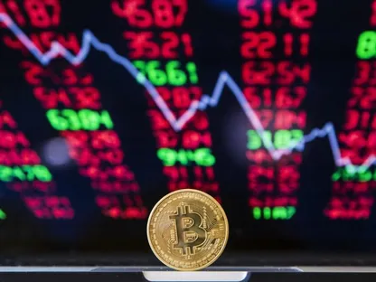 قطعة رمزية تحمل شعار العملة المشفرة \"بتكوين\" وفي الخلفية صورة رسم بياني لحركة الأسعار في السوق - AFP
