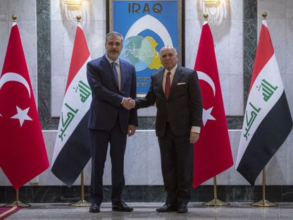 وزير الخارجية العراقي فؤاد حسين، على اليمين، مع وزير الخارجية التركي هاكان فيدان في 14 مارس 2024، بغداد، العراق - المصدر: بلومبرغ