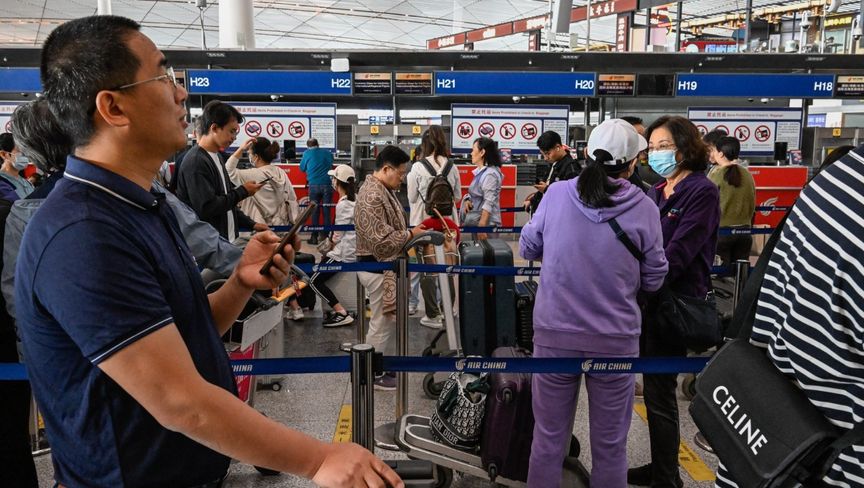 مسافرون في مطار بكين الدولي - بلومبرغ